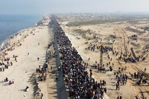 Displaced Palestinians return to their homes in the northern Gaza Strip, last January (Reuters)