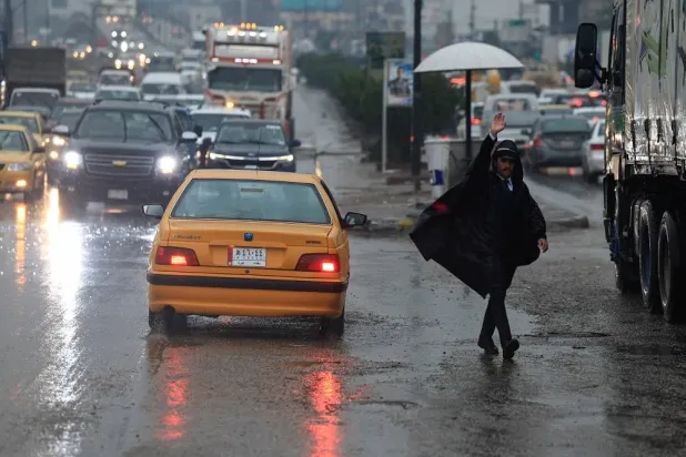 Vehicles drive during heavy rainfall in Baghdad, Iraq, March 8, 2025. (Reuters)
