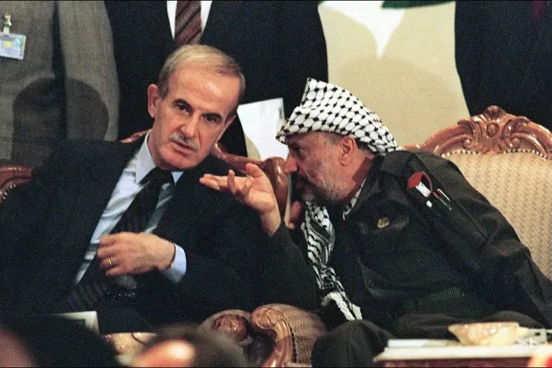 Arafat and Assad during a celebration of the Libyan Revolution in Tripoli in 1988. (AFP) 
