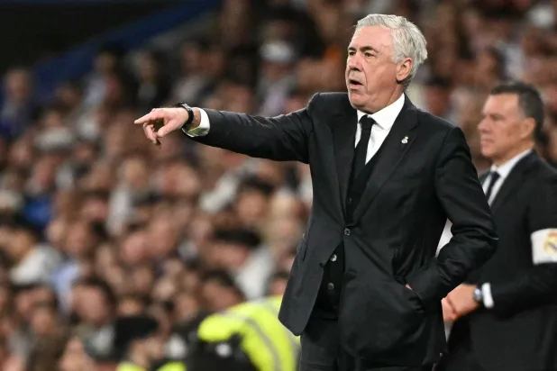 Real Madrid's Italian coach Carlo Ancelotti gestures on the touchline during the Spanish Copa del Rey (King's Cup) semi-final second leg football match between Real Madrid CF and Real Sociedad at the Santiago Bernabeu stadium in Madrid on April 1, 2025. (Photo by JAVIER SORIANO / AFP)