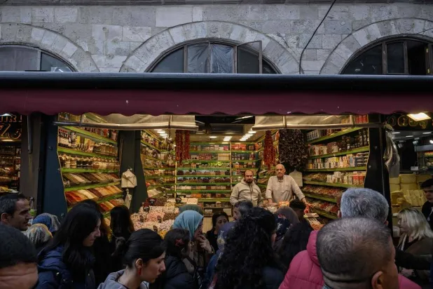 Shoppers walk through the spice bazaar in the Eminonu district of Istanbul on April 1, 2025. (AFP)