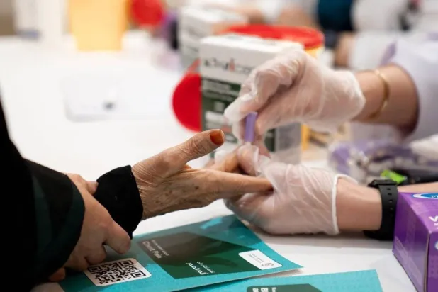 A woman checks her glucose level at a hospital in Riyadh. (Healthcare company)