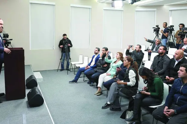 Jordanian government spokesman Mohammad Momani announces details of terrorist cell arrests in Amman. (Petra)