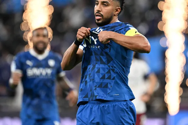 الدوسري يحتفل بأحد أهدافه في البطولة الآسيوية (تصوير: علي خمج)