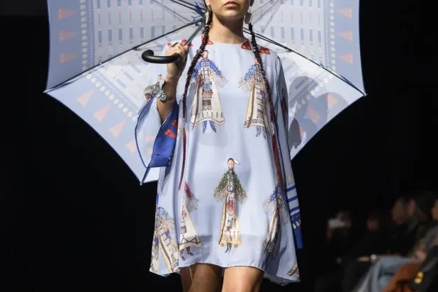 A model wears a design by Lauren Good Day on the runway at the 2025 Native Fashion Show, Friday, May 9, 2025, in Santa Fe, N.M. (AP Photo/Roberto E. Rosales)