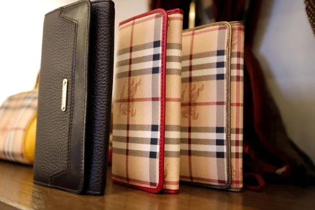 Burberry wallets are seen on display at a Burberry store in Beijing November 29, 2013. (Reuters)