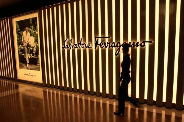 A woman walks past a Salvatore Ferragamo shop in Singapore May 19, 2017. (Reuters) 
