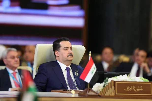 Iraq's Prime Minister Mohammed Shia al-Sudani attends the 34th Arab League summit in Baghdad on May 17, 2025. (Photo by THAIER AL-SUDANI / POOL / AFP)