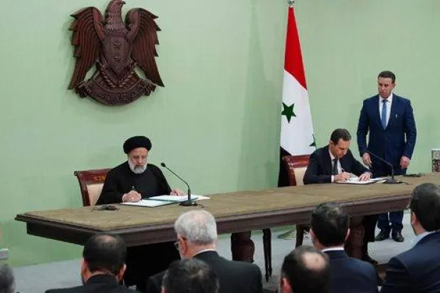 توقيع مذكرة تفاهم مايو 2023 بين الأسد وإبراهيم رئيسي في دمشق لخطة التعاون الشامل الاستراتيجي طويل الأمد مع طهران (سانا)