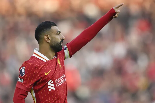 محمد صلاح يواصل أرقامه القياسية في البريميرليغ (رويترز)