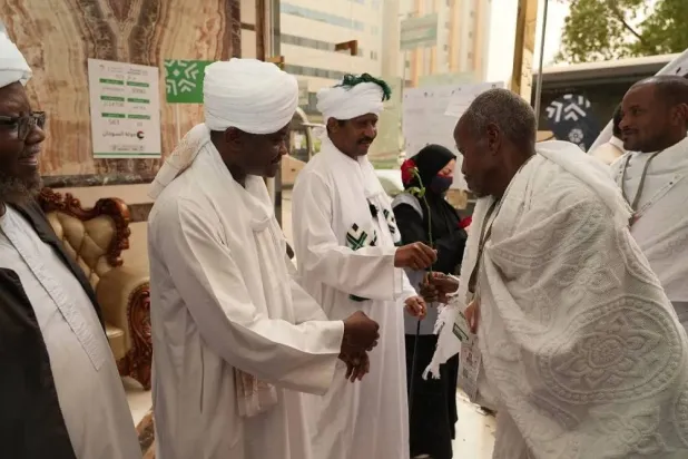 Members of the Sudanese Hajj mission welcome Sudanese pilgrims upon their arrival in the holy city of Makkah. (Sudanese Hajj mission)