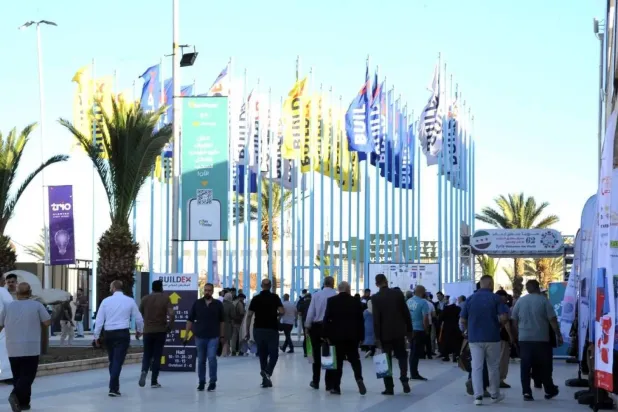 Participants preparing to enter the venue of the “Buildex” exhibition in Damascus (SANA)