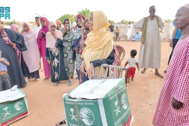 King Salman Humanitarian Aid and Relief Center distributes food aid in the city of Umm Rawaba, North Kordofan State, Sudan (SPA)