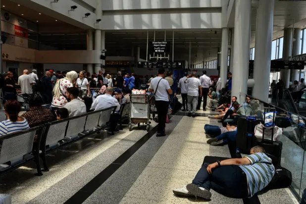 Passengers stranded in the departure hall of Rafik Hariri International Airport following flight delays (DPA) 