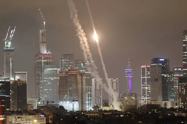 Israel's Iron Dome air defense system intercepts ballistic missiles fired from Iran over the city of Tel Aviv, Israel, 15 June 2025. EPA/ATEF SAFADI