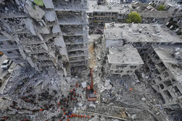 Israeli soldiers search through the rubble of residential buildings destroyed by an Iranian missile strike in Bat Yam, central Israel, on Sunday. (Associated Press) 