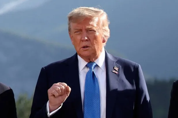 US President Donald Trump gestures as he attends a family photo session during the G7 Summit, in Kananaskis, Alberta, Monday, June 16, 2025. (AP)