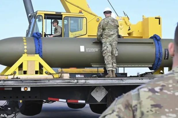  In this photo released by the US Air Force on May 2, 2023, airmen look at a GBU-57, or the Massive Ordnance Penetrator bomb, at Whiteman Air Base in Missouri.(US Air Force via AP, File) 