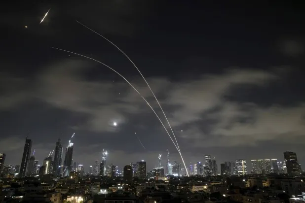 Israeli air defense system fires to intercept missiles during an Iranian attack over Tel Aviv, Israel, early Wednesday, June 18, 2025. (AP)