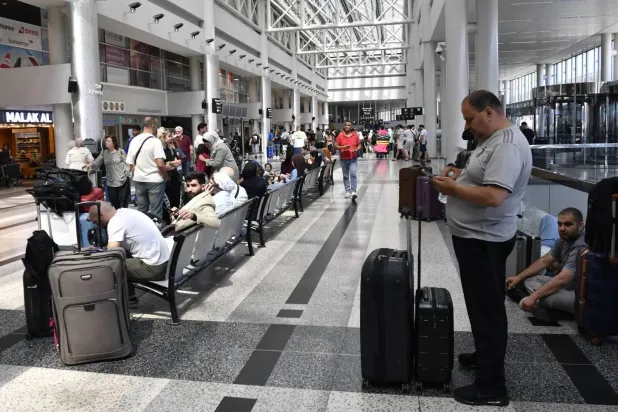 Passengers wait at Beirut airport amid disruptions caused by Israeli-Iranian conflict (EPA) 