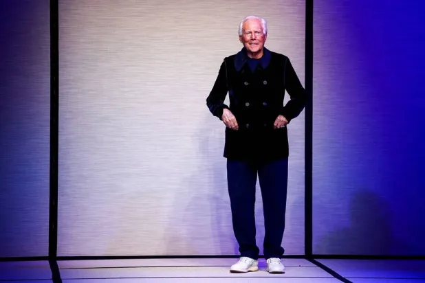 Designer Giorgio Armani appears at the end of the Giorgio Armani Fall-Winter 2025/2026 menswear collection during Milan Fashion Week, in Milan, Italy, January 20, 2025. (Reuters)