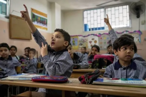 Students in an English class at a primary school run by URWA for Palestinian refugees at the Mar Elias refugee camp in Beirut, Lebanon, Monday, June 2, 2025. (AP Photo/Hassan Ammar) 