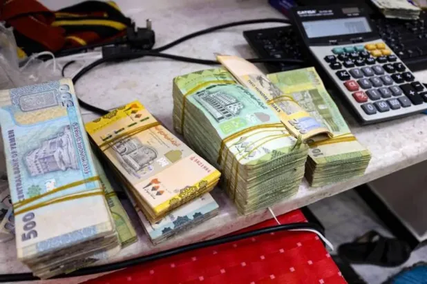 Fears mount over the impact of military escalation on the Yemeni currency, which has recently seen a rapid decline (AFP). 