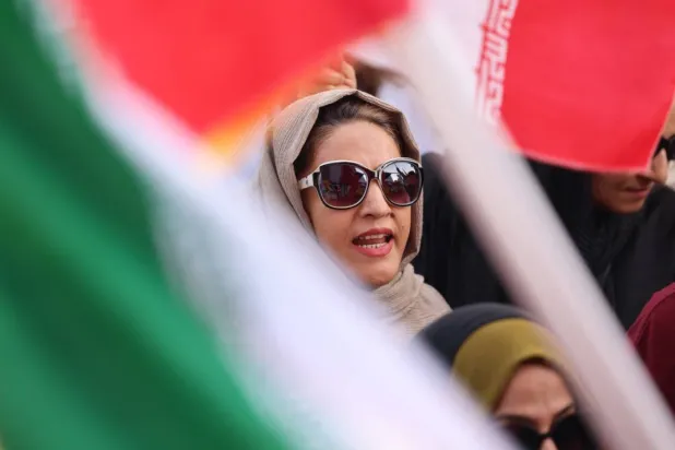 Analistlere göre İran halkı protesto gösterilerinden saldırgan yabancı güçlerle iş birliği yapmayı reddettiği için uzak duruyor (AFP)