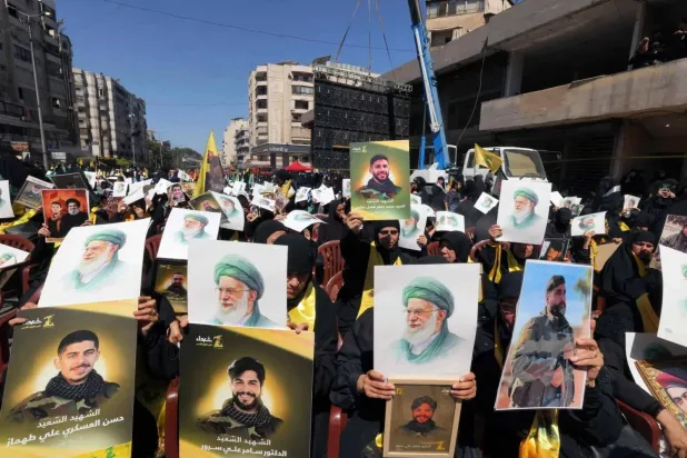 Lebanese Shiite mourners gathered on Monday in Beirut’s southern suburbs to mark Ashura in a ceremony organized by Hezbollah (AFP)