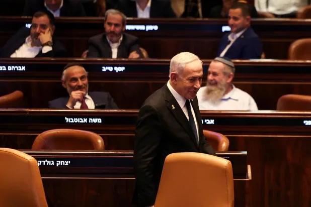  Israeli Prime Minister Benjamin Netanyahu walks in the Knesset, Israel's parliament, on the day of a vote over a possible expulsion of Ayman Odeh from parliament, in Jerusalem, July 14, 2025. (Reuters)