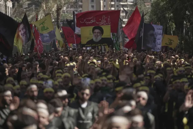 Hezbollah supporters take part in Ashura commemorations in Beirut’s southern suburbs last week (AP)