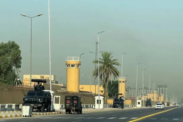 Vehicles belonging to the Iraqi security forces are seen outside the US embassy in Baghdad. Reuters file photo