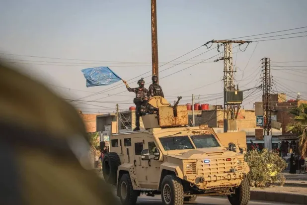 The SDF stages a military parade in Hasakah, northeast Syria, on Monday. (Asharq Al-Awsat) 
