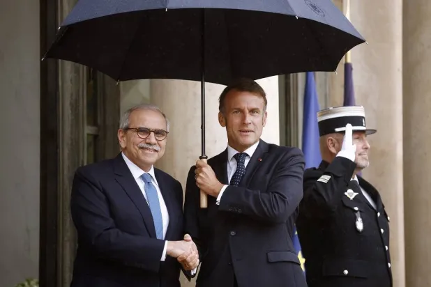 French President Emmanuel Macron (R) greets Lebanese Prime Minister Nawaf Salam (L) upon his arrival at the Elysee Palace in Paris, France, 24 July 2025. (EPA)