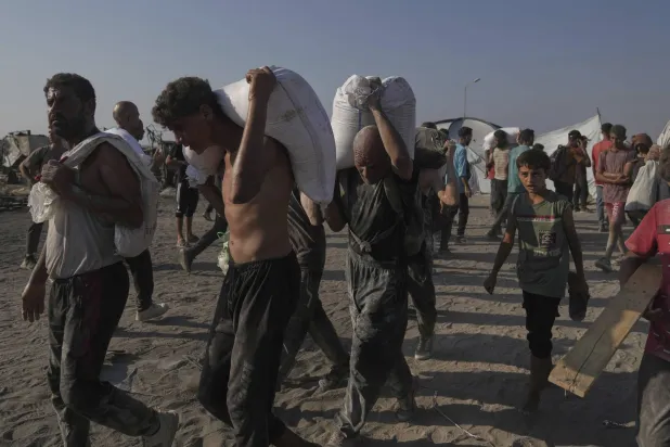 Aid Trucks Move from Egypt to Gaza after Israel Said it Began Airdrops