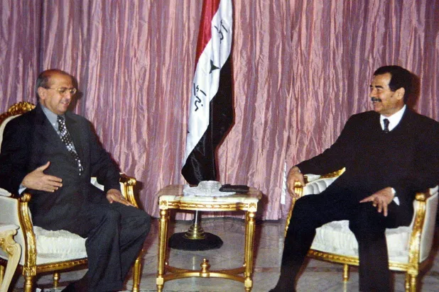 Saddam Receives Yemen’s then-Foreign Minister Abubakr al-Qirbi in Baghdad in 2001 (AFP)  