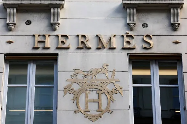 A logo of fashion house Hermes is seen outside a shop in Paris, France, April 15, 2024. (Reuters) 