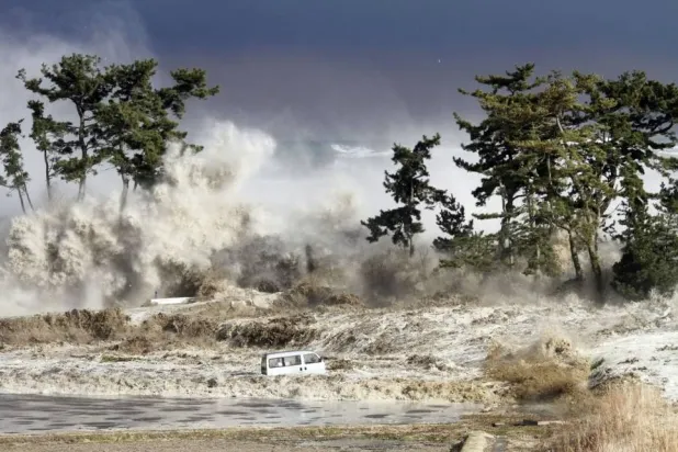 Tsunami waves hit the coast of Minamisoma in Fukushima Prefecture, photographed on March 11, 2011. (Sadatsugu Tomizawa / AFP / Getty Images) 