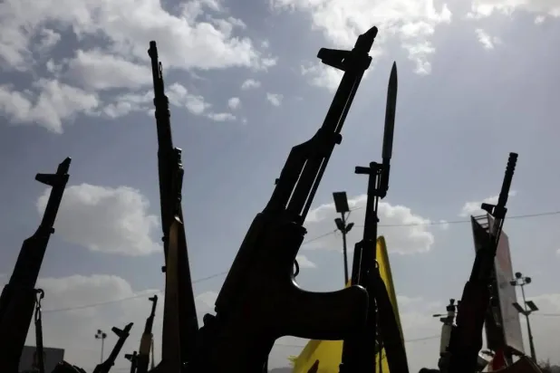 Houthi supporters hold up weapons during a protest against the US and Israel, in Sanaa, Yemen, 18 July 2025. (EPA)