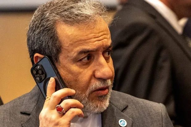 Iranian Foreign Minister Abbas Araghchi makes a phone call during the 51st Session of the Council of Foreign Ministers of the Organization of Islamic Cooperation (OIC) in Istanbul, Türkiye, June 21, 2025. (Reuters) 