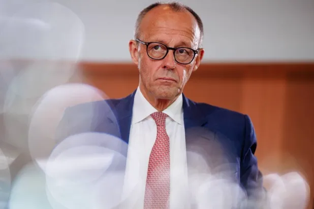 German Chancellor Friedrich Merz looks on at the start of a cabinet meeting of the federal government in Berlin, Germany, 30 July 2025. (EPA)