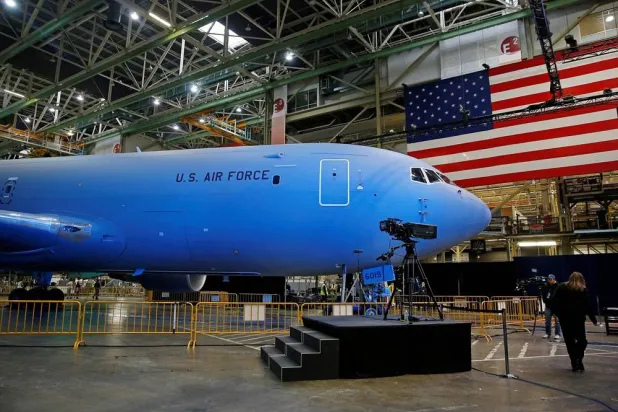 he Boeing KC-46 Pegasus aerial refueling tanker is bathed in blue light before a delivery celebration to the US Air Force in Everett, Washington, US, January 24, 2019. (Reuters)