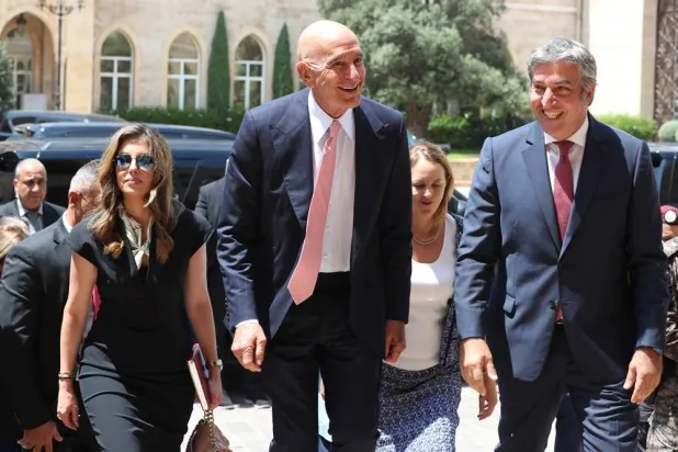 US Ambassador to Türkiye and Special Envoy to Syria Tom Barrack (C), and US Deputy Special Envoy for the Middle East Morgan Ortagus (L) arrive for a meeting with Lebanese Prime Minister Nawaf Salam at the government palace in Beirut, Lebanon, 18 August 2025. (EPA) 