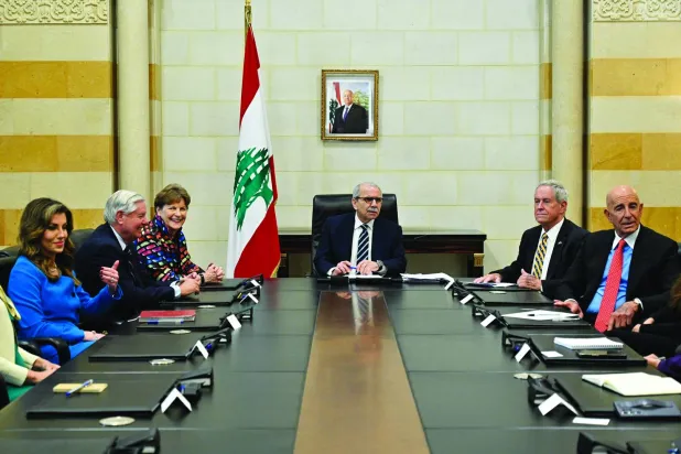 
رئيس الحكومة اللبنانية نواف سلام مستقبلاً الوفد الأميركي (إ.ب.أ)