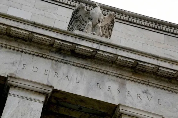 An eagle tops the US Federal Reserve building's facade in Washington, July 31, 2013. (Reuters)
