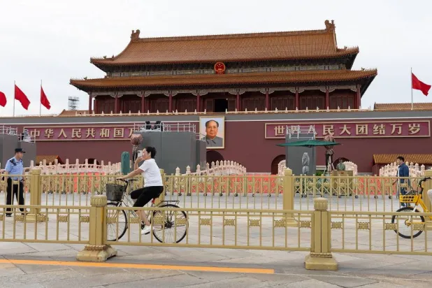 A person bikes in Tiananmen Square ahead of the 80th anniversary of the second Sino-Japanese War, in Beijing, China, 30 August 2025. (EPA)