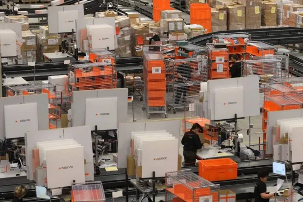 Picture taken on December 12, 2012 shows employees of the internet retail company Zalando working at a logistics center in Erfurt, eastern Germany. (AFP/Getty Images) 