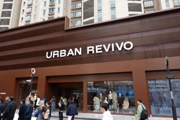Visitors are walking past the first flagship store of the fast fashion brand Urban Revivo in Shanghai, China, on March 6, 2024. (AFP) 