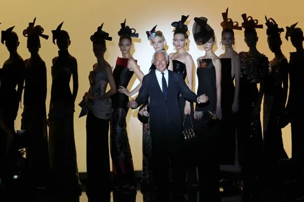 Italian designer Giorgio Armani acknowledges the public at the end of the Giorgio Armani Prive during the Fall/Winter 2011-2012 Haute Couture Collection Show on July 5, 2011 in Paris. (AFP) 