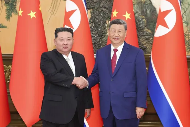 China’s Xi and North Korea’s Kim Pledge Deeper Ties During Meeting in Beijing